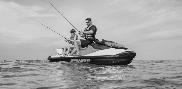 Father and son fishing from a Sea-Doo personal watercraft