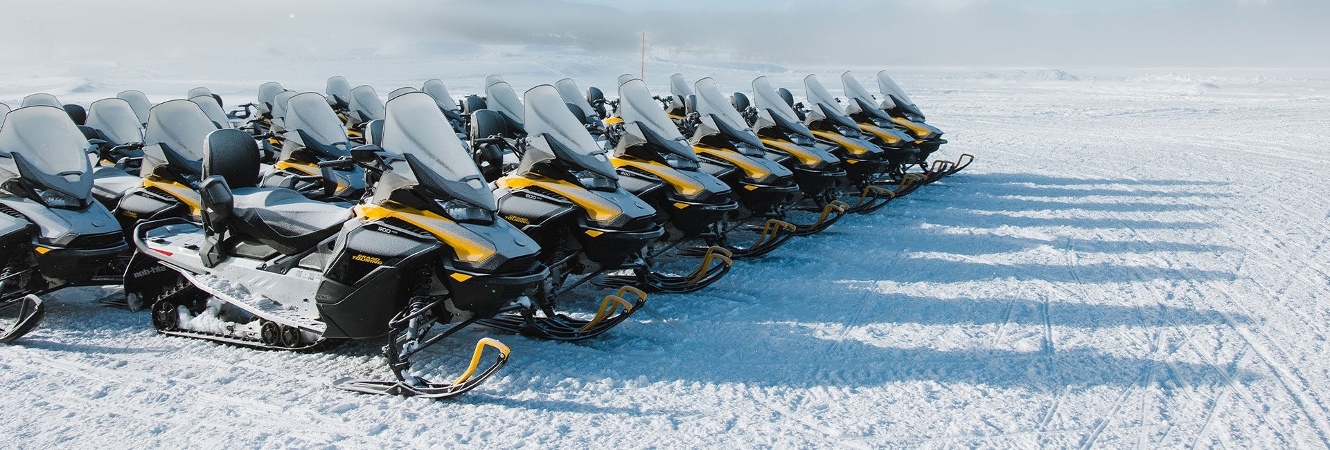 Rows of Ski-Doo Grand Touring Electric snowmobile