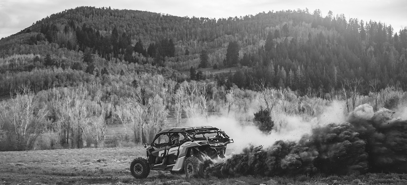 Can-Am Maverick SxS vehicle riding in the dirt