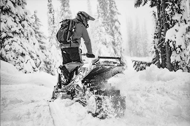 Snowmobile riding in deep snow
