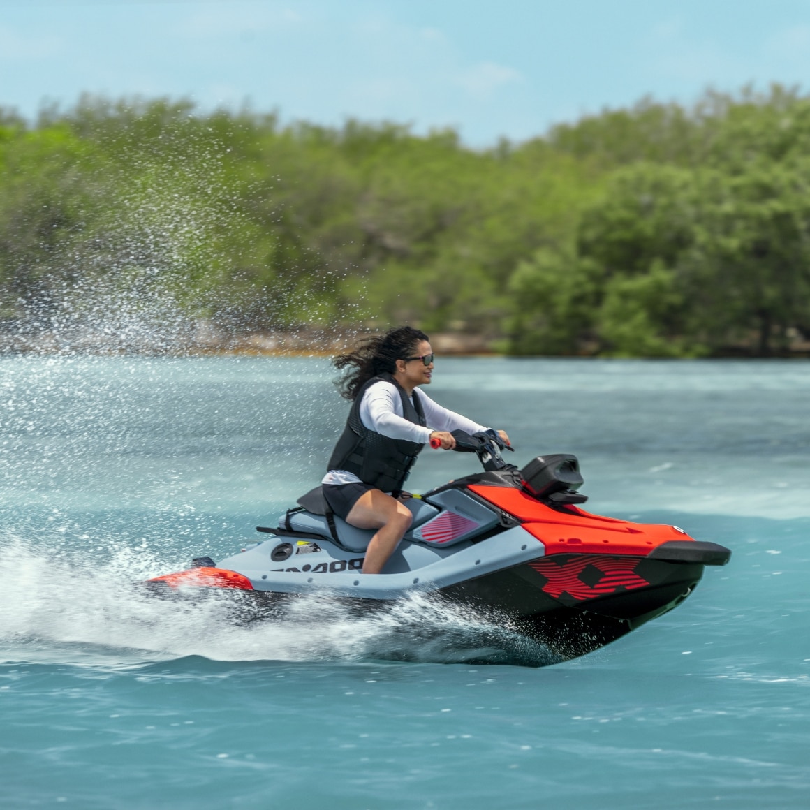 A woman a Sea-Doo Spark X on the water